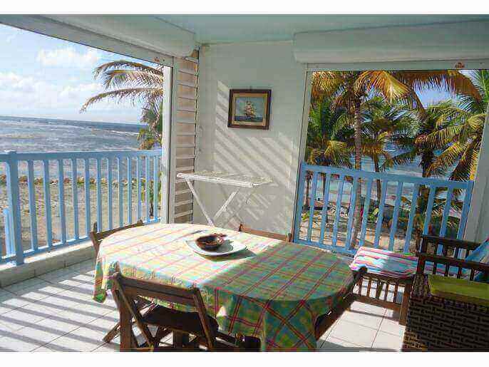 Location VillaAppartement en Guadeloupe - salle  manger vue mer